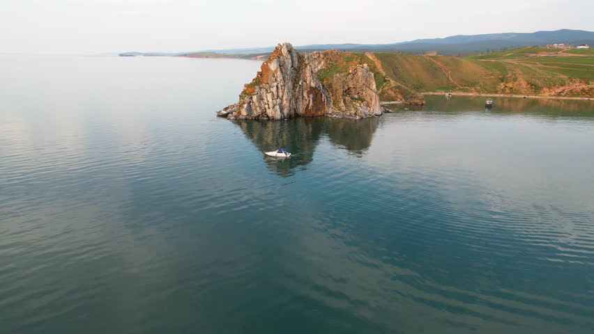 View from the water to Cape Burkhan or Shamanka Rock. 