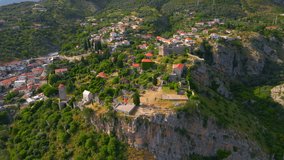 The drone captures a mesmerizing view of the ruins of Stari Bar, showcasing the remains of stone buildings that hold historic significance. This stock video depicts the beauty of Montenegro's ancient