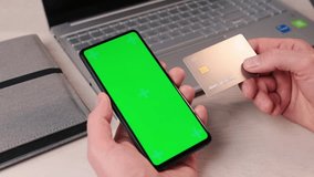 Hand holding mobile phone mockup, green screen and bank credit card for paying online. Internet payment app, application ad - Powered by Shutterstock - Get 15% off with code: PIKWIZARD15