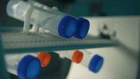 Expertise. Stock footage. Test tubes with analyses rotating around on a special device. - Powered by Shutterstock - Get 15% off with code: PIKWIZARD15