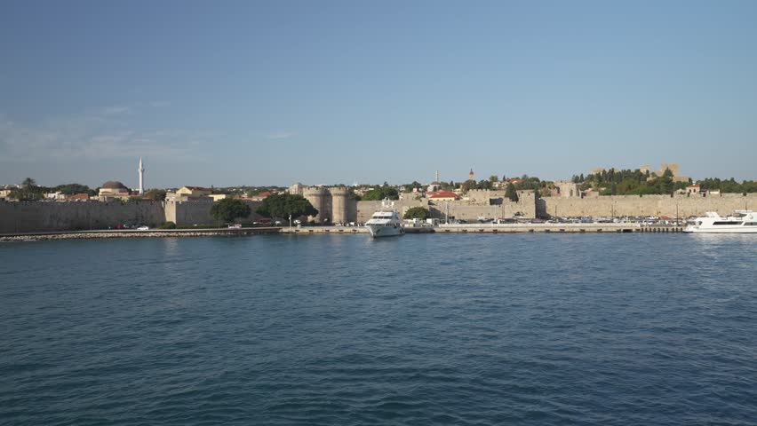 Shot of Rhodes Town from ferry leaving port, Rhodes Old Town, Rhodes, Dodecanese Islands, Greek Islands, Greece, Europe