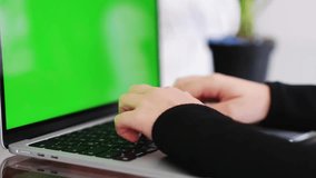 Young woman studying from her laptop, green screen, horizontal video