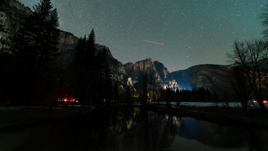 Time lapse of starry sky over Yosemite Falls at night in Yosemite National Park in California, USA
