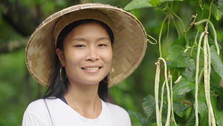 Young happy female asian farmer, cheerful female smallholder portrait, asia