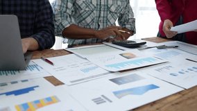 Financial analyst analysis business financial report on digital tablet during discussion at meeting of corporate showing the results of their successful teamwork., business meeting concept, Marketing - Powered by Shutterstock - Get 15% off with code: PIKWIZARD15