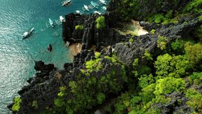 4k Drone Flys over Swimmers at Secret Beach Palawan Philippines