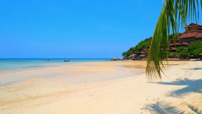 A stroll on the beach in Koh Phangan is a truly enchanting experience, with soft sand underfoot, gentle sea breezes and the sound of waves lapping at the shore. Thailand. nature and travel concept.
