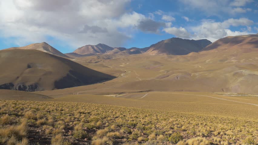Typical Andean landscape with meadows and gigantic mountains, in Bolivia
