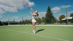 Pro tennis player hits the ball with a racket, practice game on the tennis court, woman serving ball during tennis match, 4k slow motion. - Powered by Shutterstock - Get 15% off with code: PIKWIZARD15