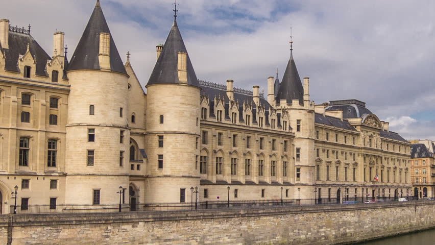 Castle Conciergerie timelapse hyperlapse - former royal palace and prison. Aerial view from Bridge to Change. Part of larger complex known as Palais de Justice. Paris, France.