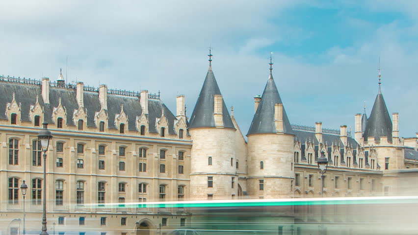 Castle Conciergerie timelapse - former royal palace and prison. Bridge to Change. Conciergerie located on the west of the Cite Island. Part of larger complex Palais de Justice. Paris, France.