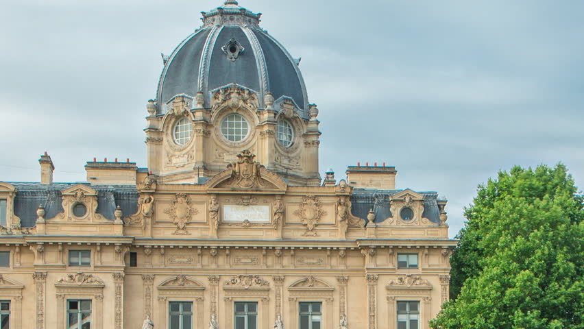 Castle Conciergerie and Commercial Court of Paris timelapse - former royal palace and prison. Bridge to Change. Conciergerie located on the west of the Cite Island. Paris, France.