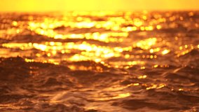 Abstract nautical summer ocean sunset background with blurred waves, sun reflections, and bokeh. Seamless panorama and sky replacement enhance the serene beauty of the golden sea.