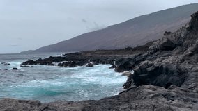 waves crashing on cloudy day at Tacoron beach in El Hierro, Canary Islands