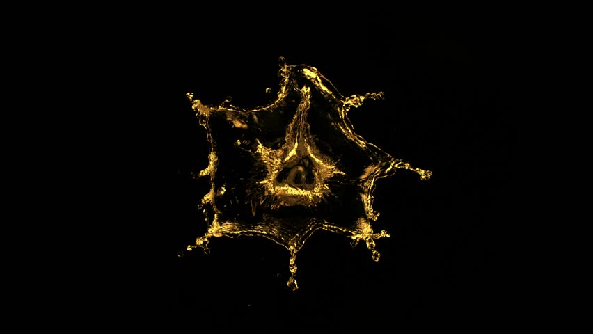 Super slow motion of splashing golden liquid isolated on black background. Filmed on high speed cinema camera, 1000 fps.