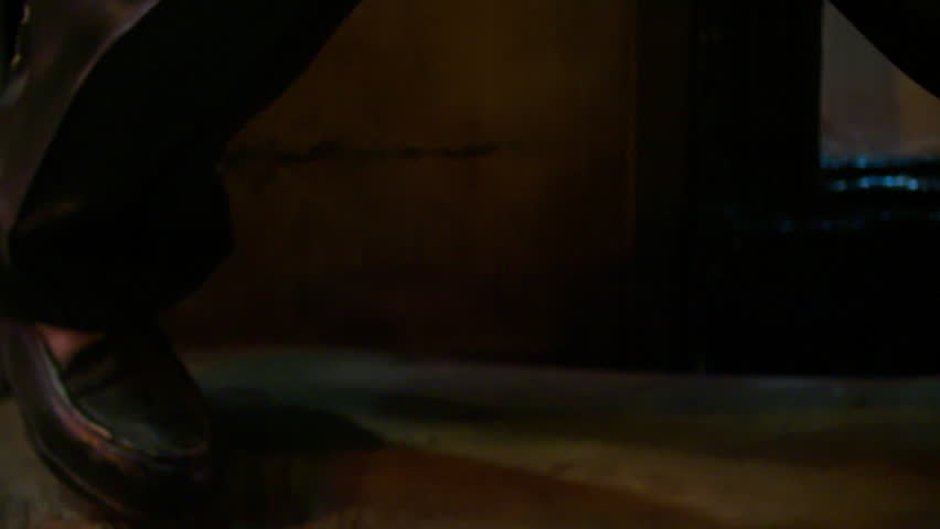 Slow Motion Tilt-Up Shot Of Male Statue At Night - Los Angeles, California