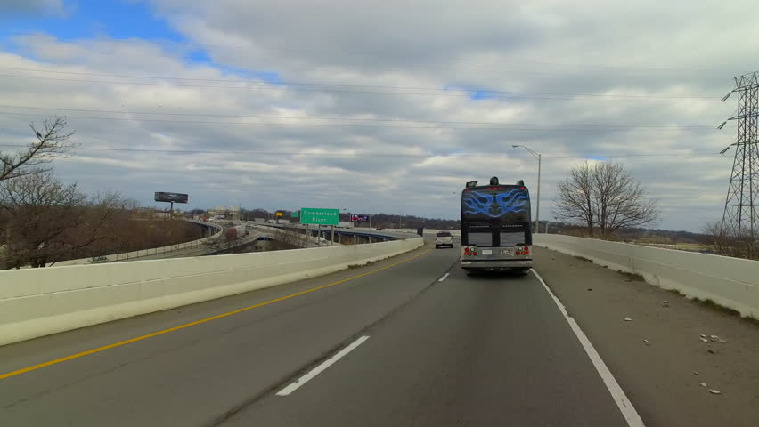 Pov Shot Of Recreational Bus And Cars Moving On Highway Under Cloudy Sky - Nashville, Tennessee