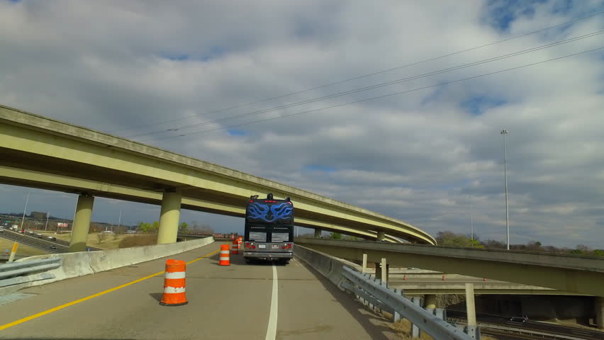 Pov Shot Of Luxury Bus And Cars Moving On Bridges Under Cloudy Sky - Nashville, Tennessee