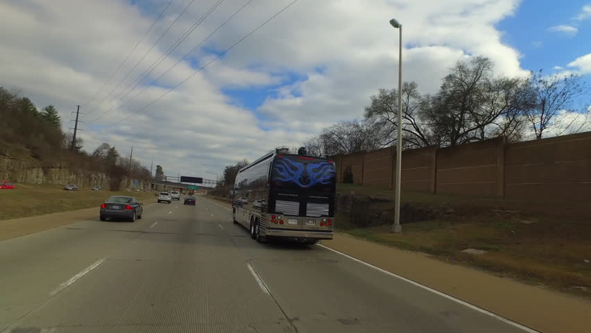 Pov Shot Of Luxury Bus And Cars Moving On Road Under Cloudy Sky - Nashville, Tennessee