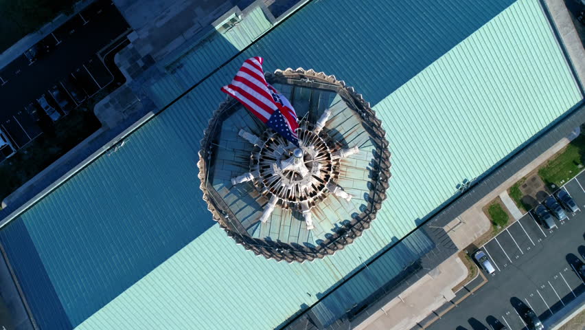 Aerial Tilt Up Shot Of Tennessee State Capitol In Modern City Against Clear Sky, Drone Flying Backwards On Sunny Day - Nashville, Tennessee