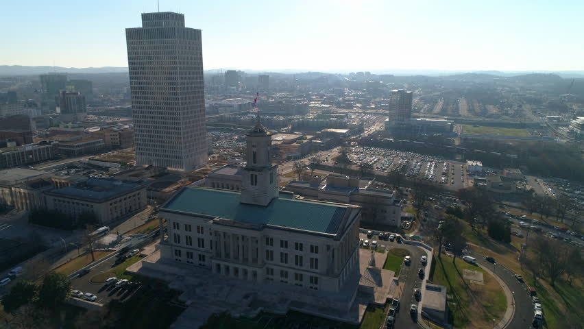 Aerial Forward Shot Of State Government Office By Financial Building In City Against Clear Sky On Sunny Day - Nashville, Tennessee