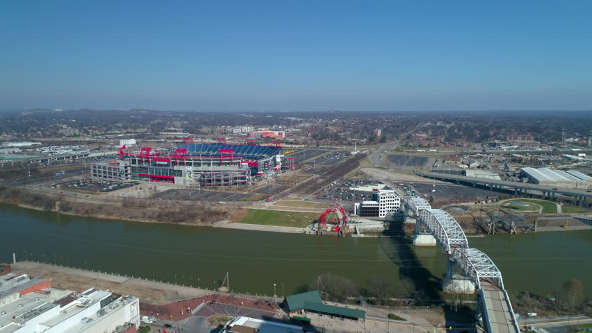 Aerial Backward Shot Of Famous Landmarks In Residential City Against Clear Sky On Sunny Day - Nashville, Tennessee