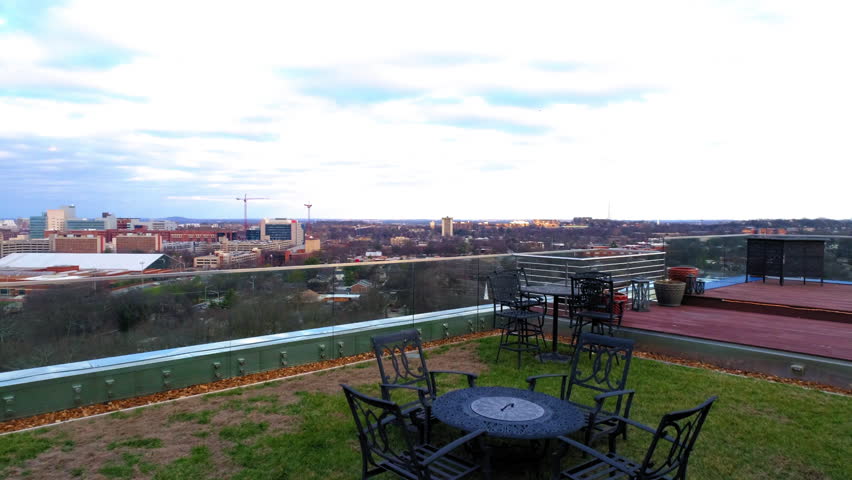 Aerial Forward Panning Shot Of Residential Buildings In City Seen From Balcony Under Cloudy Sky - Nashville, Tennessee