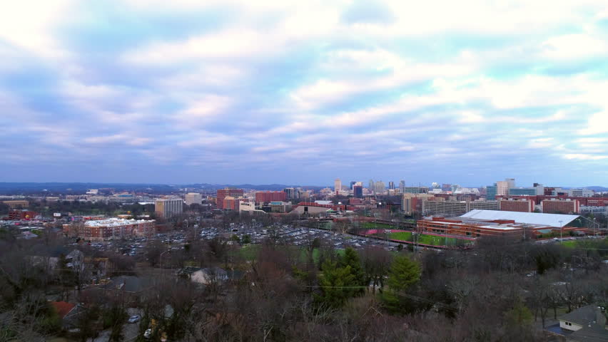 Aerial Forward Beautiful View Of Buildings In City Under Cloudy Sky - Nashville, Tennessee