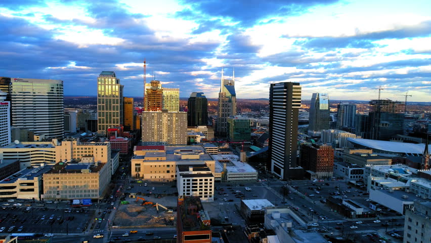 Aerial Panning Shot Of Vehicles Moving On Roads Amidst Residential Buildings During Sunset In Modern City - Nashville, Tennessee