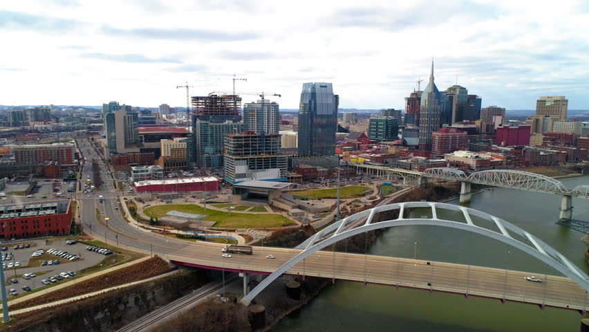 Aerial Lockdown Shot Of Famous Bridges Over River By Residential Buildings In City - Nashville, Tennessee