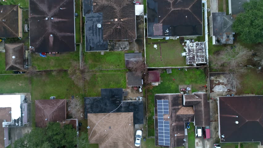 Aerial Forward Tilt Up Shot Of Roofed Houses On City Landscape Against Sky - New Orleans, Louisiana