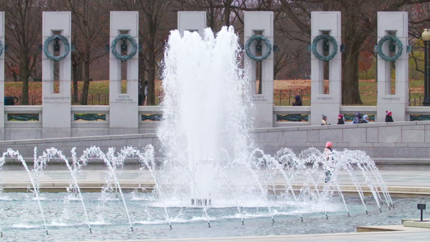 Slow Motion Lockdown Shot Of Water Fountain At Famous World War Ii Memorial While People Exploring On Vacation - Washington, District of Columbia