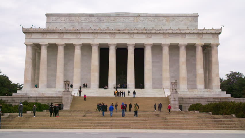Lockdown Shot Of Male And Female Tourists Exploring Lincoln Memorial During Vacation - Washington, District of Columbia