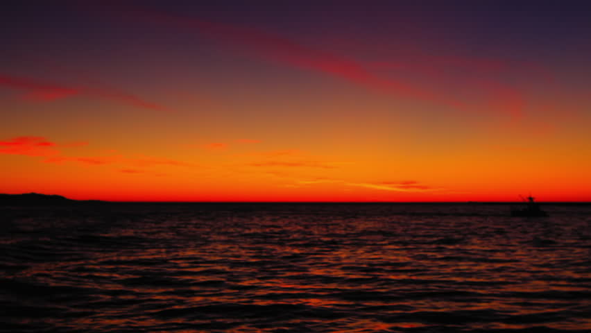 Point Of View Shot Of Wavy Seascape Under Orange Sky During Sunset - Dubai, United Arab Emirates