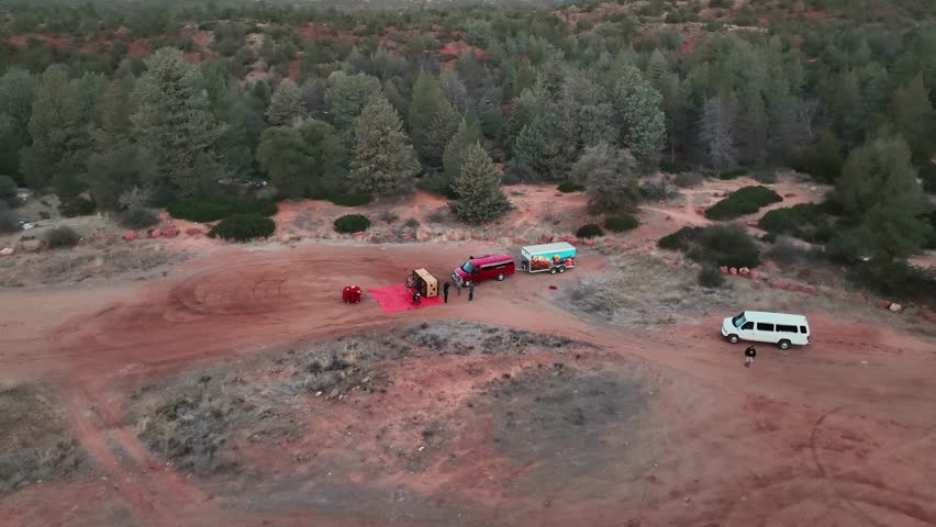 People With Their Camping Vehicles On Scenic Landscape Of Sedona In Arizona, USA. aerial orbit