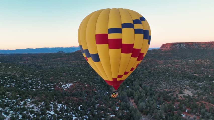 Hot Air Balloon Ride Over Sedona Red Rocks At Sunrise - aerial drone shot
