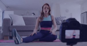 Animation of media icons over caucasian woman exercising at home. Social media, sport and digital interface concept digitally generated video.