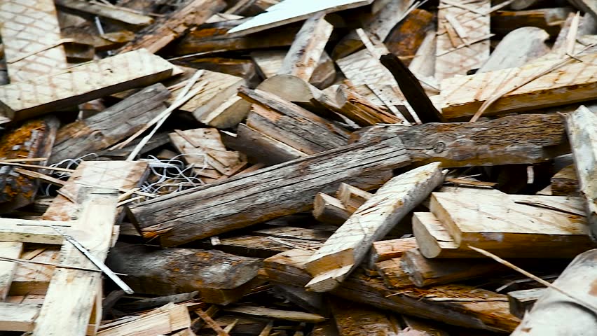 Construction garbage is piled up at site after building repair. Trash heap. Pile of home rubbish thrown after renovation. Waste and timber dumped. Cleaning and sorting garbage after demolition jobs. Royalty-Free Stock Footage #1102326455