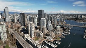 Footage of Downtown Vancouver with view of Yaletown Burrard and Granville bridges on a beautiful sunny Spring day