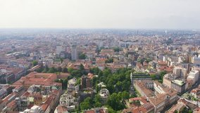 Inscription on video. Milan, Italy. Roofs of the city aerial view. Cloudy weather. Heat burns text, Aerial View