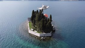 Montenegro. Adriatic Sea. Boko-Kator Bay.  Filming from a drone. Flying over the islands of St. George and Our Lady on a cliff at low altitude.
