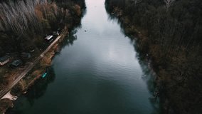 Aerial video footage of rowers on the river. Rowing as seen from above. 