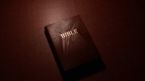 Holy Bible book on table. Religious video.
