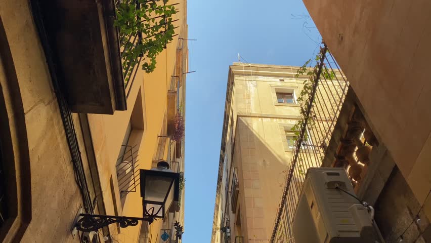 POV Looking Up House Exterior Of Balconies Lined In Barcelona Gothic Quarter	
