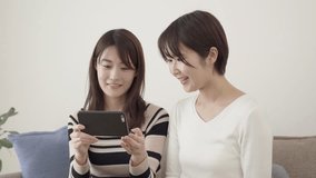 Asian women using smart phones