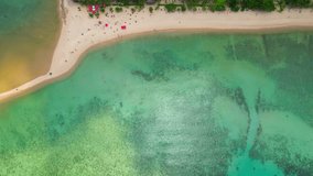 An exquisite aerial view captures a stunning sandbar encircled by the glistening, transparent waters, creating an idyllic paradise. (Koh Ma, Koh Phangan, Thailand). beauty of nature concept. 4K
