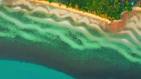 Beautiful sandbar appears, stretching out towards the horizon, and adding to the stunning beauty of the scene. The sandbar seems to glow in the sunlight, with its bright white sand. Thailand. Drone
