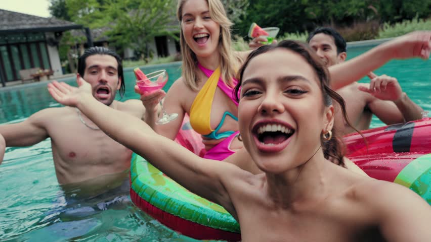 Groups of Multiculturalism Friends make a selfie or video call talk to long-distance friends having fun in pool party and enjoying outdoors travel holiday vacation trip at private pool villa Royalty-Free Stock Footage #1102378461