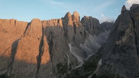 Aerial video over the Dolomites mountain range, at sunset. Northern Italy Tyrol