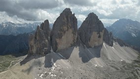 Aerial video on the Dolomites, the Tre Cime di Lavaredo triangle of peaks. on a sunny day north Italy